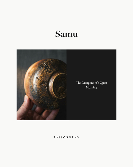 A pair of hands holding a thick-walled Bizen ware stoneware cup in the quiet of an early morning, embodying the Zen discipline of Samu and mindful daily ritual